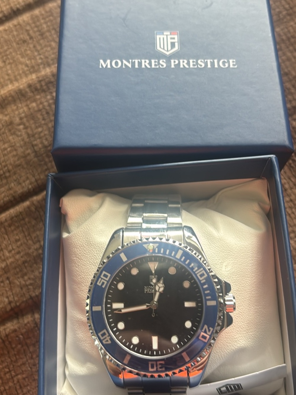 Invicta Silver Stainless Steel Watch with Blue Bezel and Black Dial